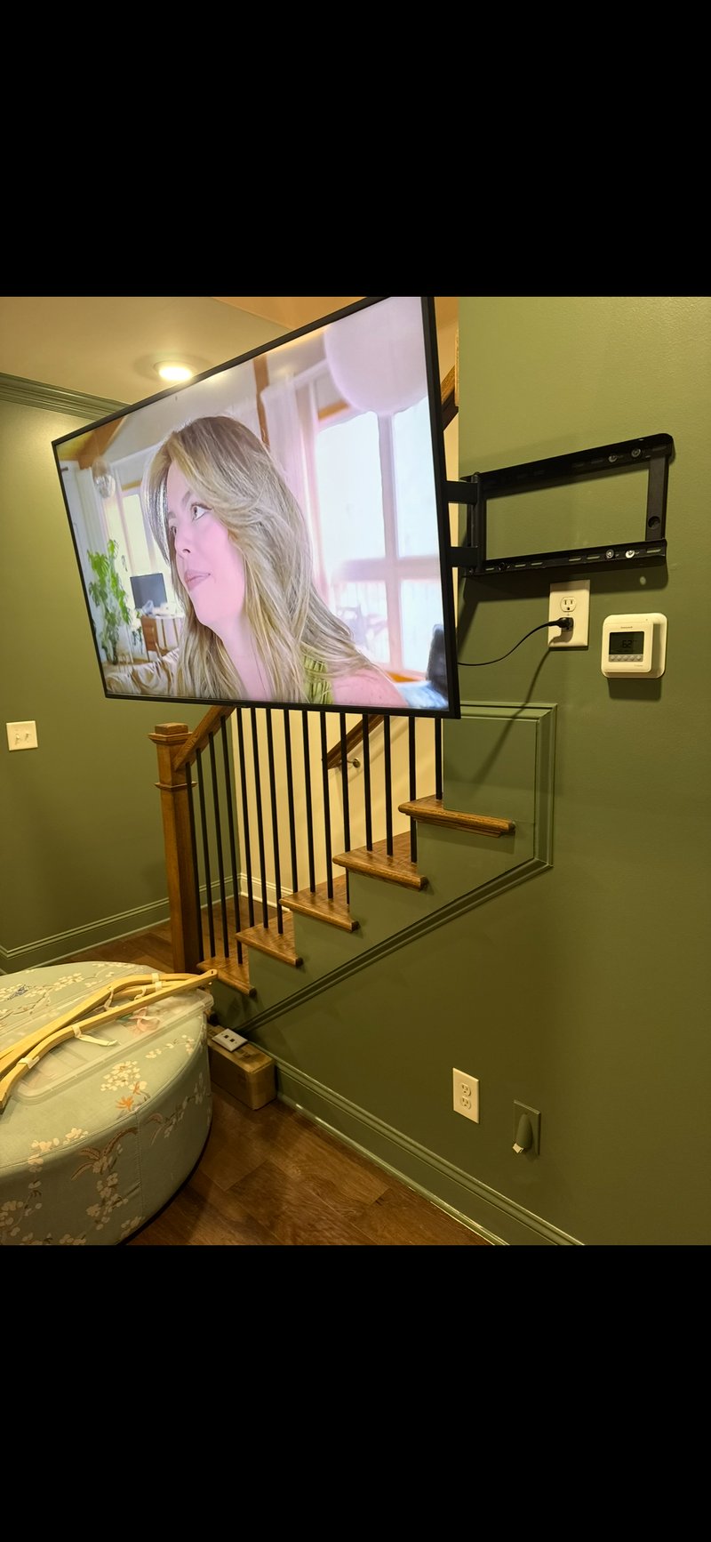 Articulating TV mount over staircase